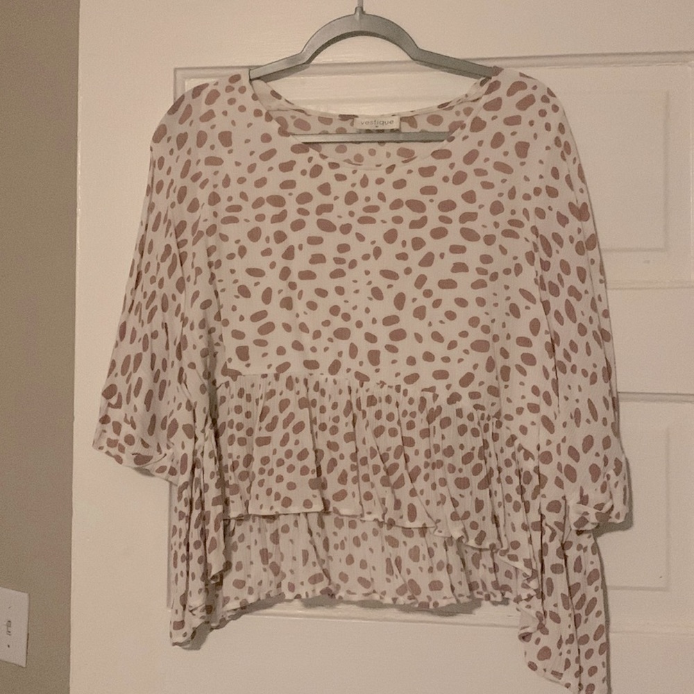 Vestique pink spotted peplum style top